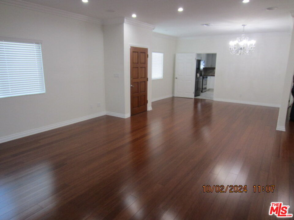 a view of a livingroom with wooden floor