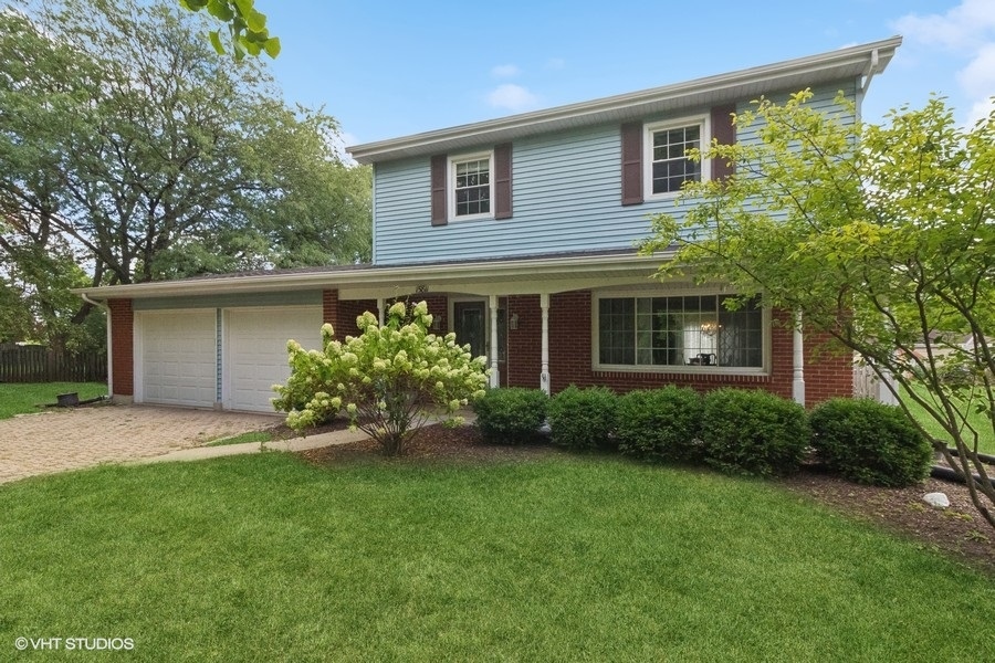 front view of a house with a yard