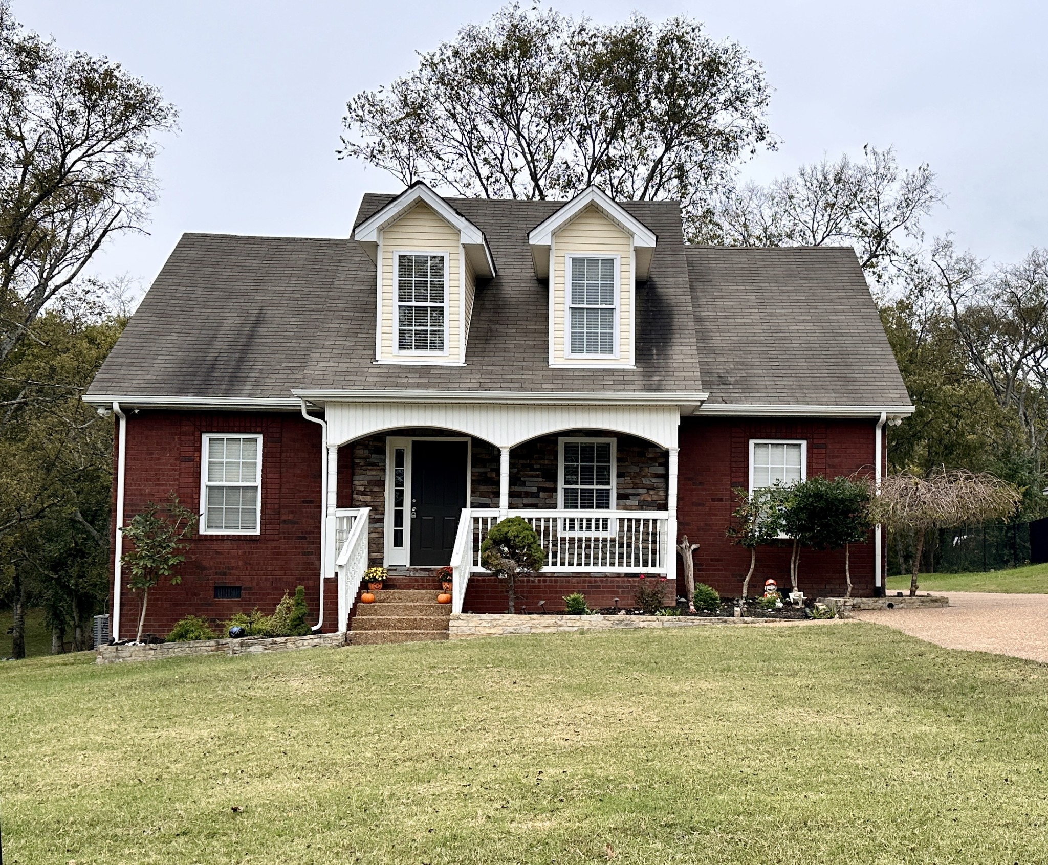 a front view of a house with a yard