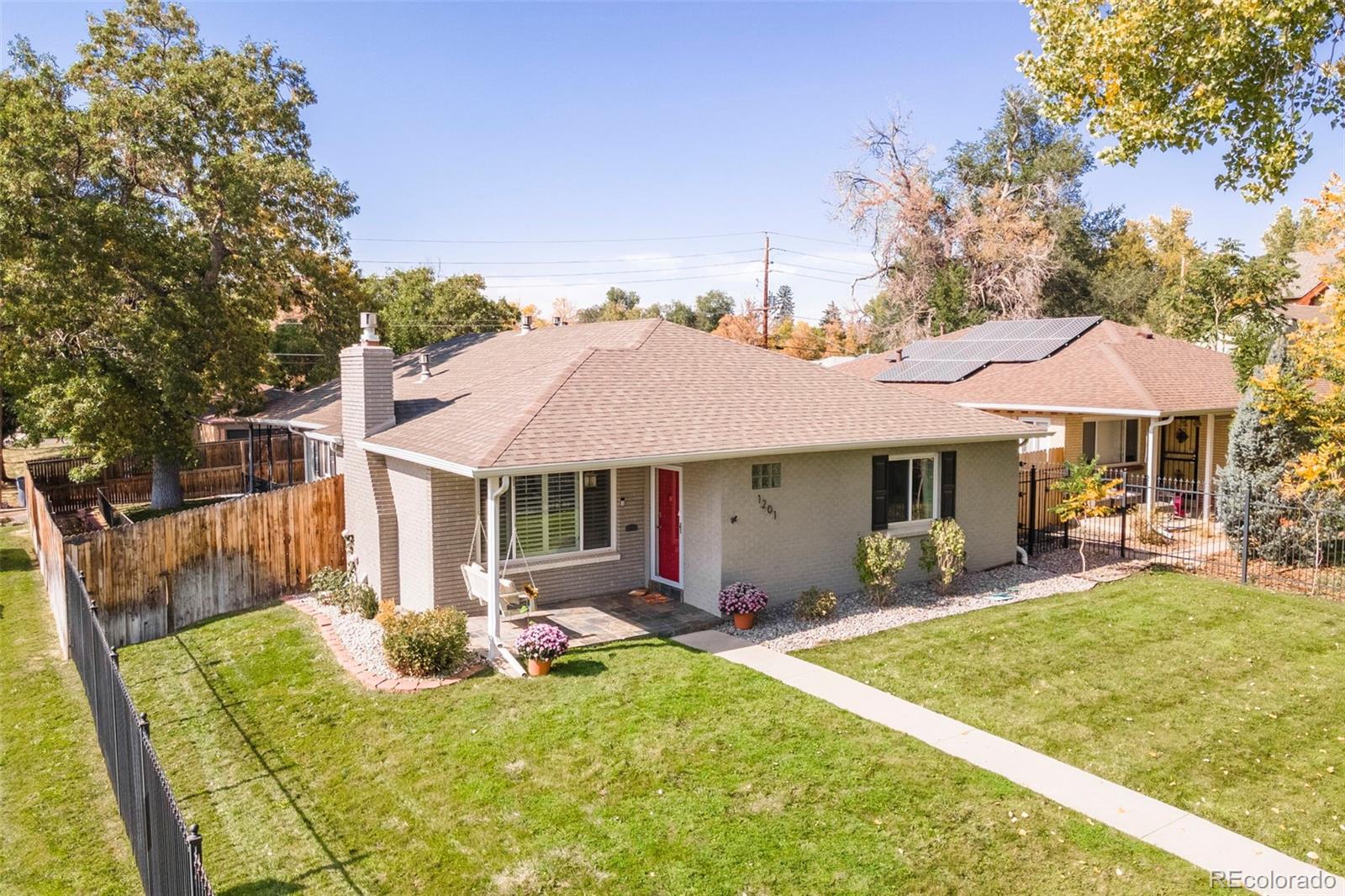 a front view of house with yard and outdoor seating