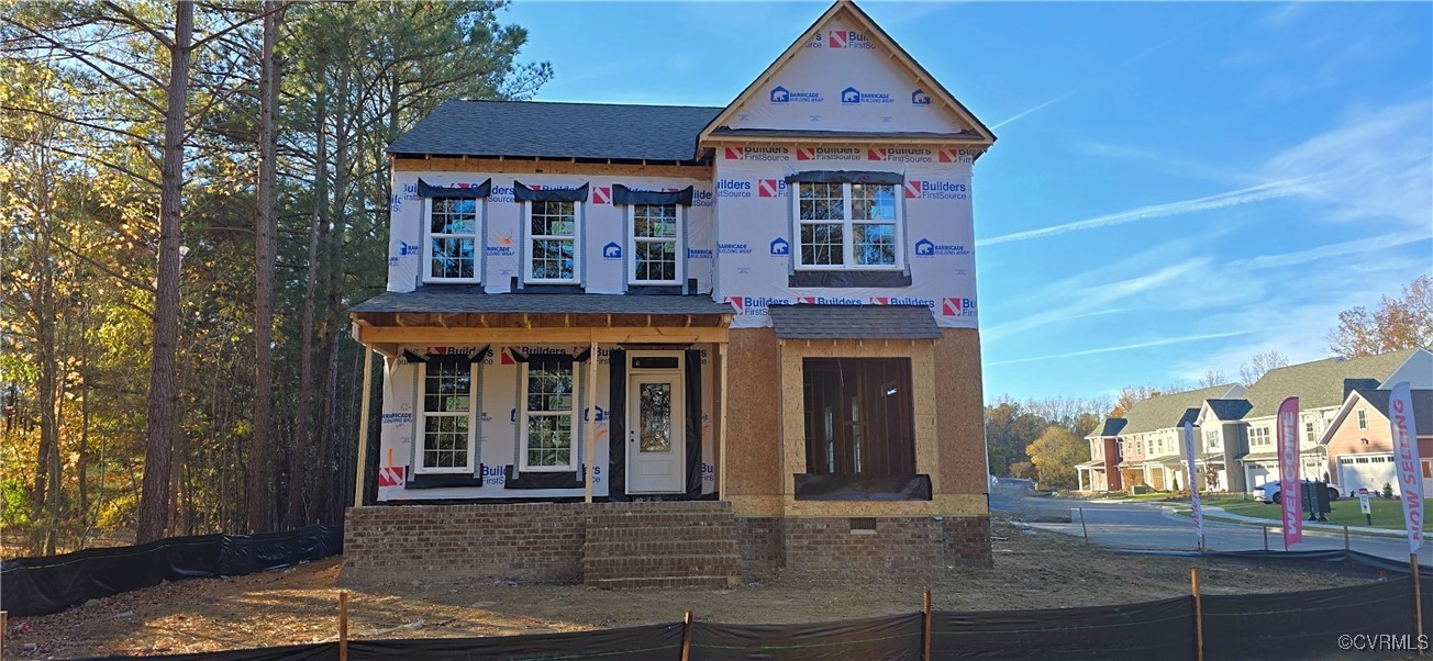 front view of a house with a yard