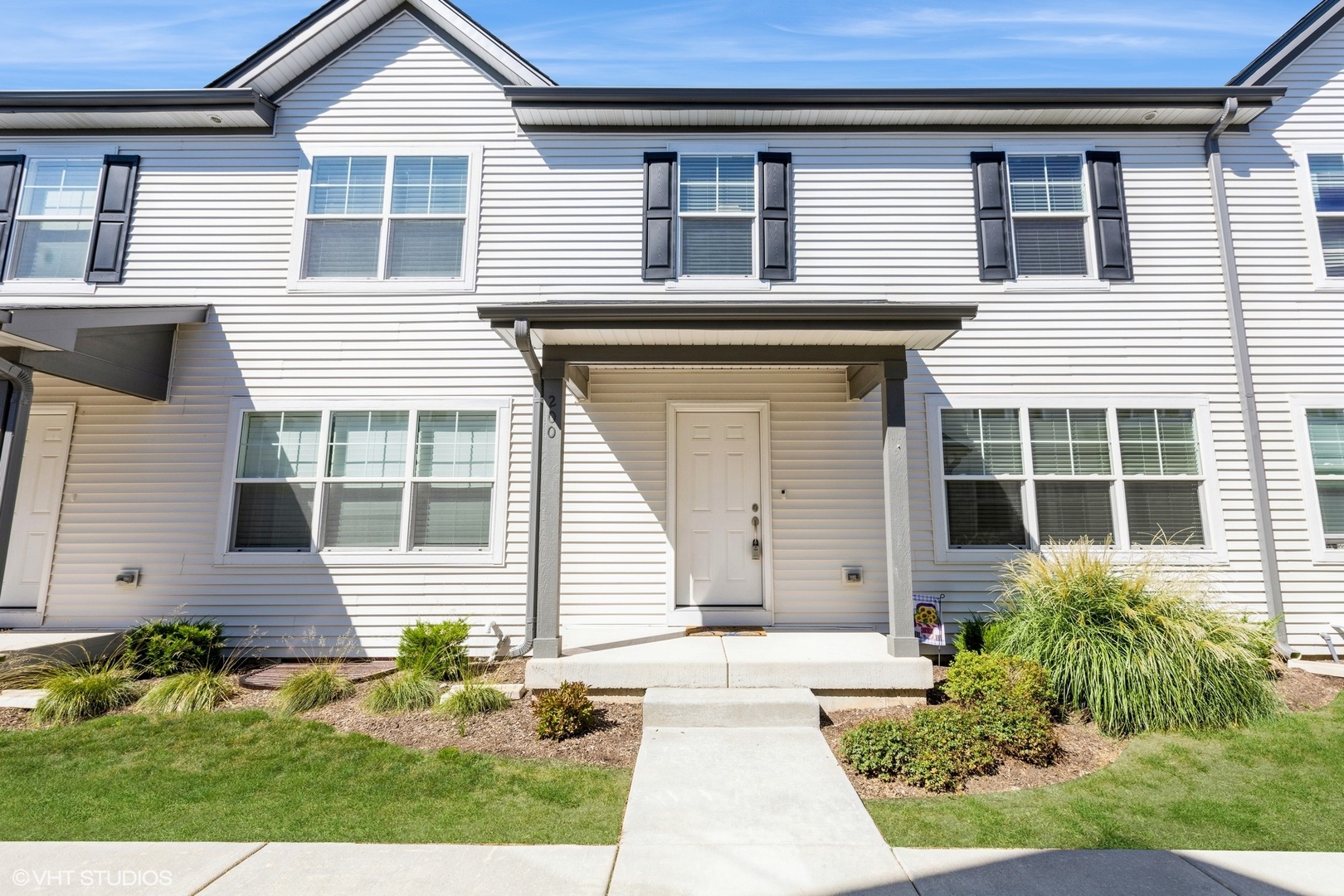 a front view of a house with a yard