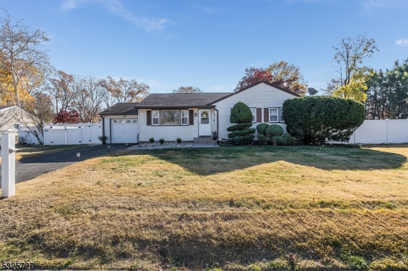 a view of a house with a yard covered with snow in front of house