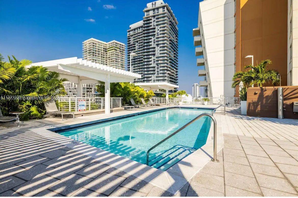 a view of a swimming pool with a lounge chairs