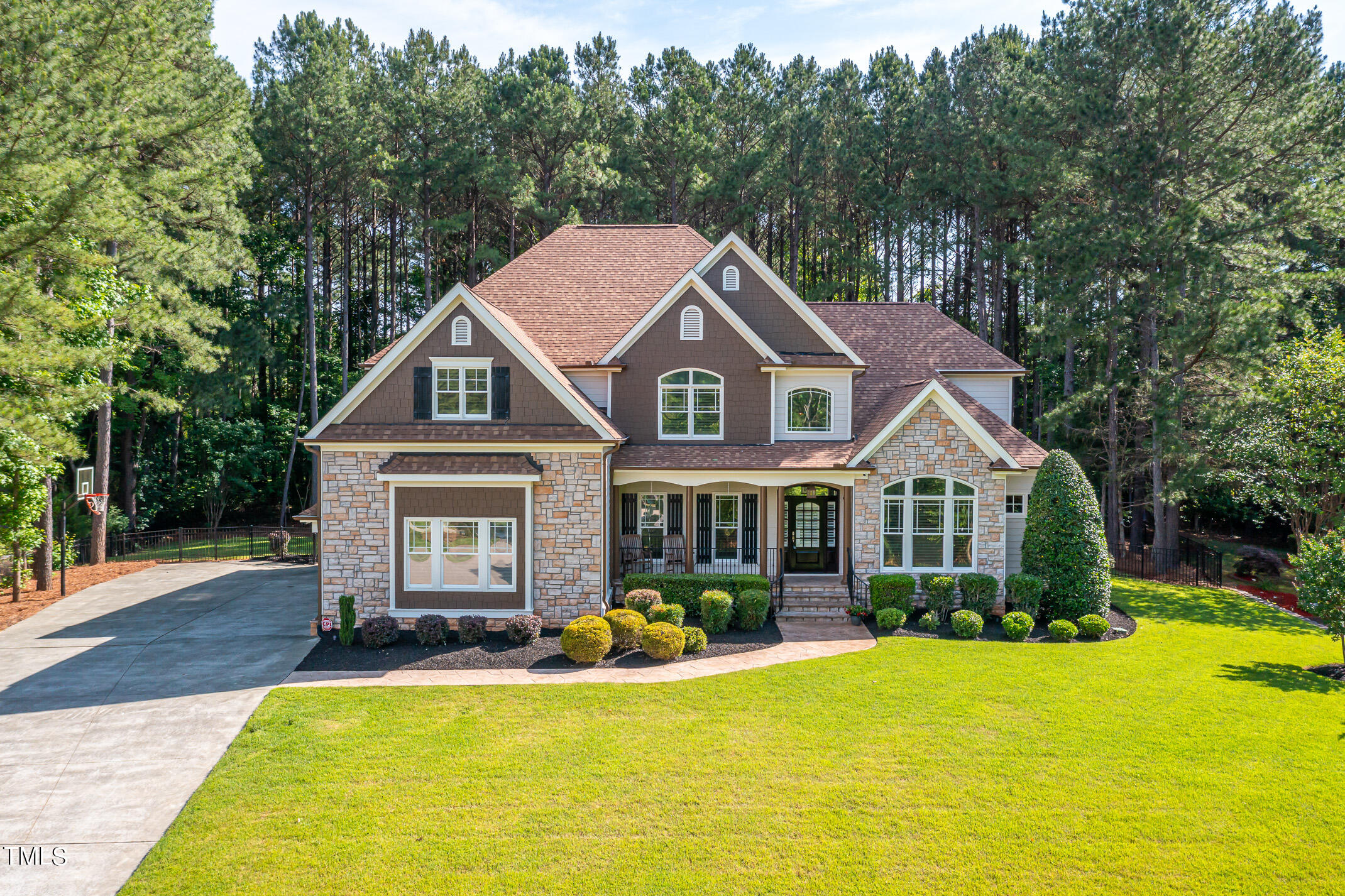 a view of a house with swimming pool and porch