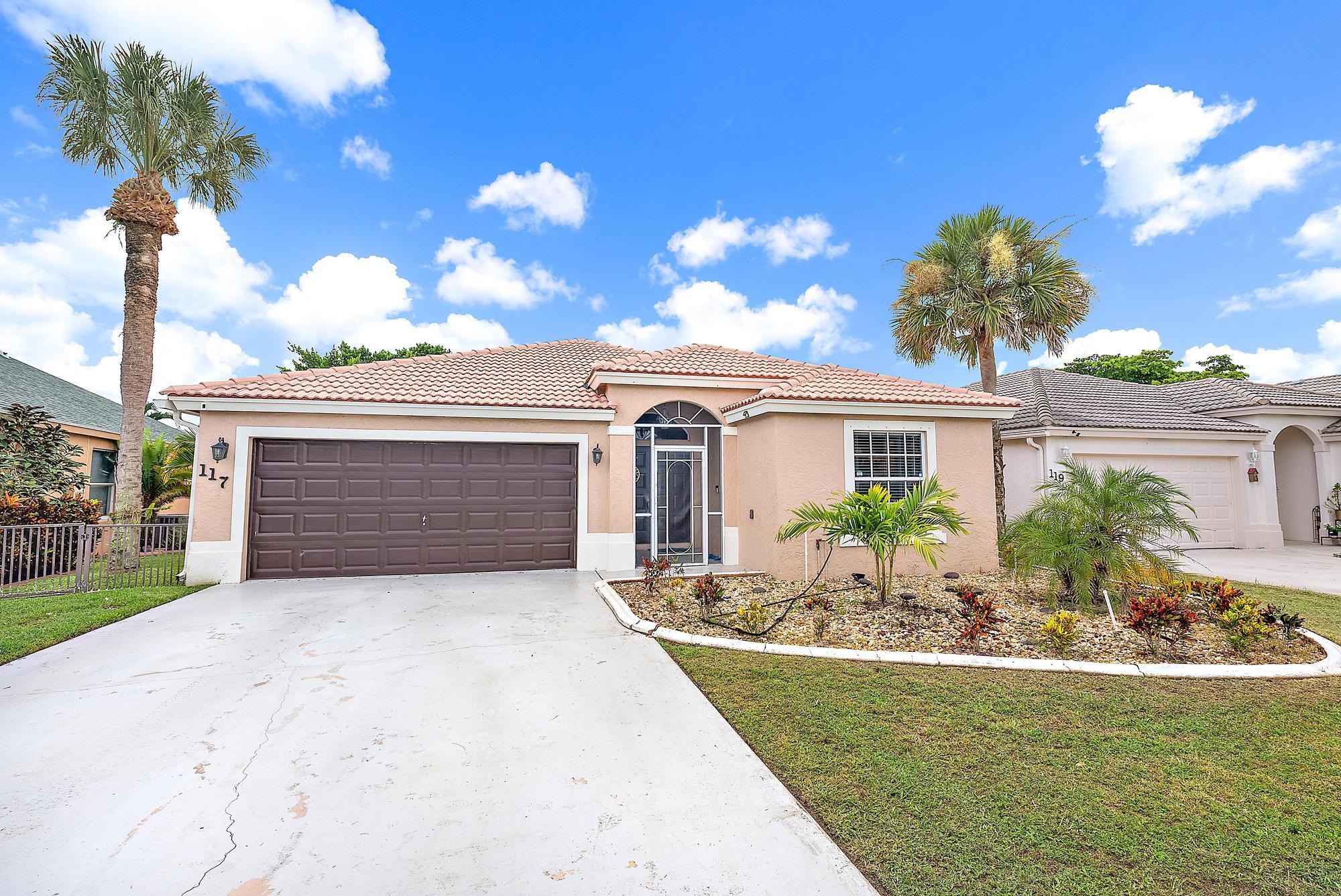 a front view of a house with yard