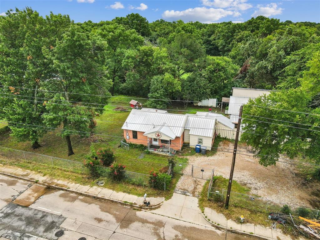 a aerial view of a house with garden space and street view