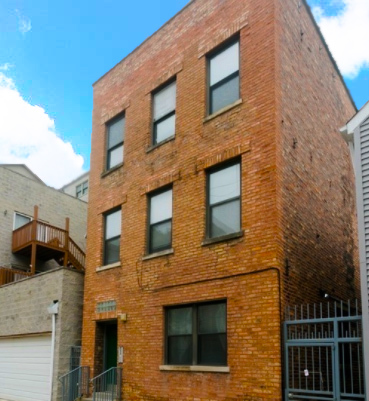 a brick building with a large windows