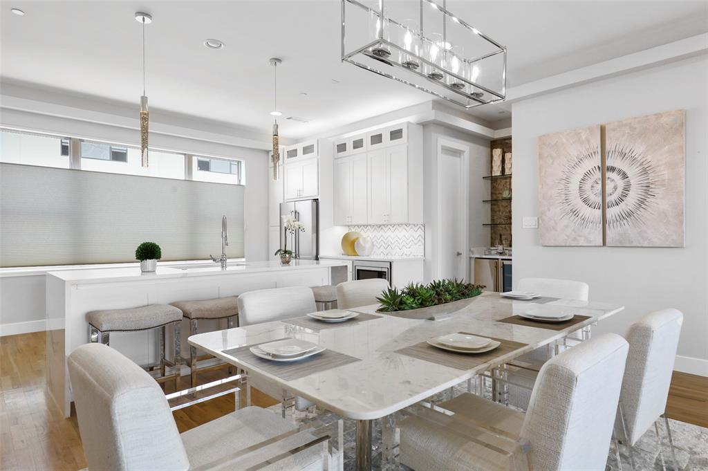 a white table and chairs in a kitchen