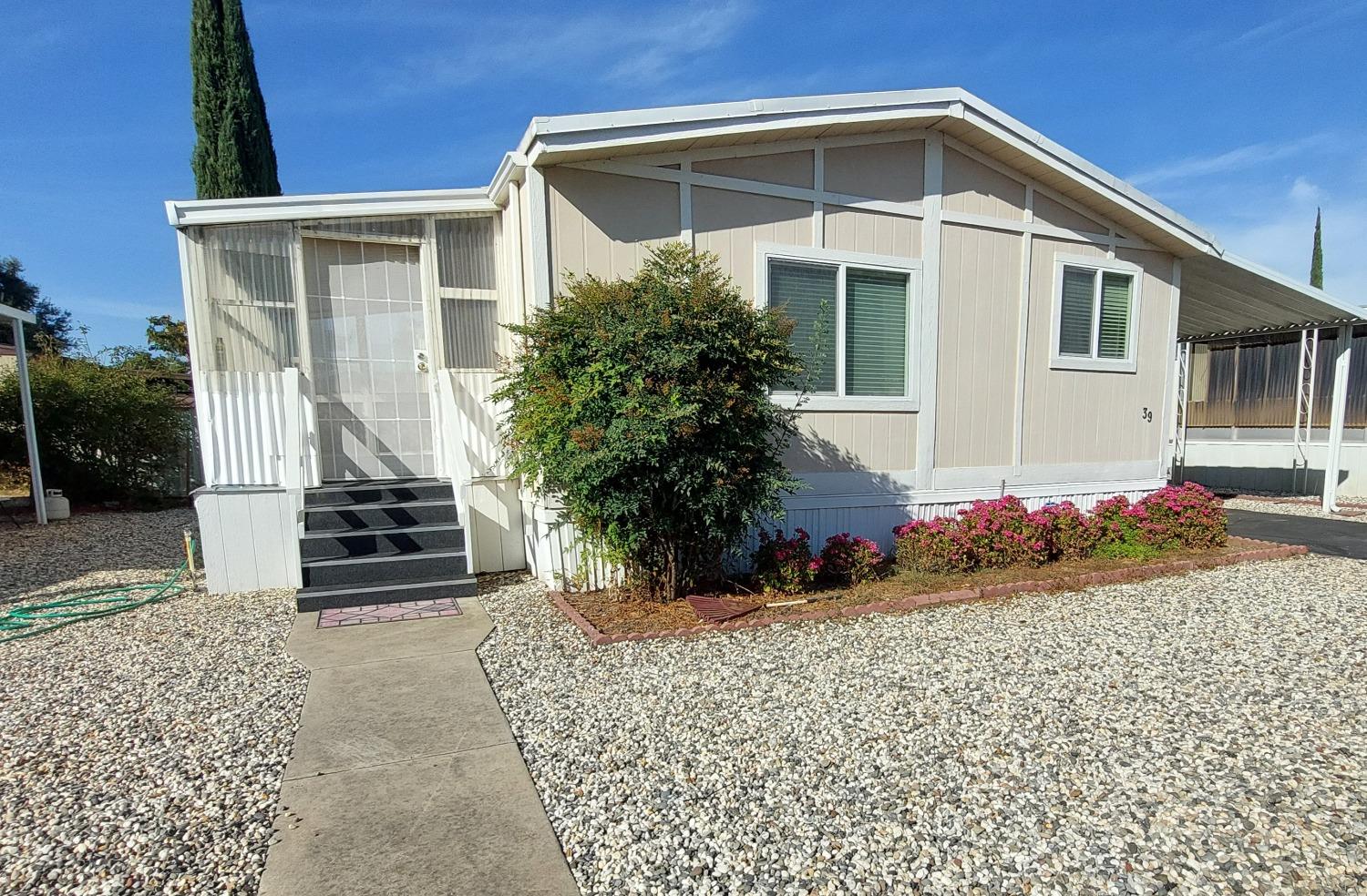 a front view of a house with garden