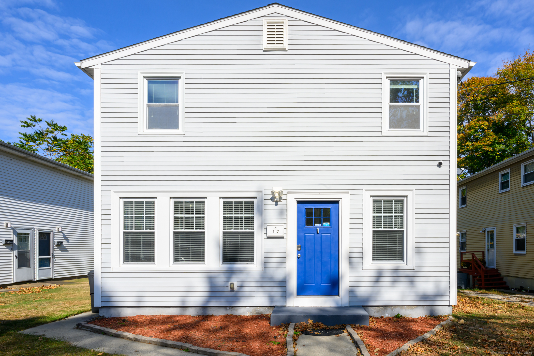 a front view of a house with yard