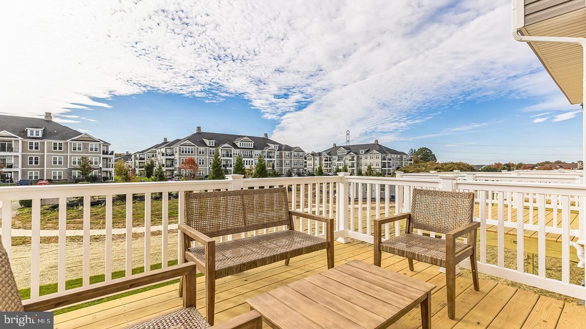 a view of a balcony with chairs