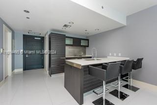 a kitchen with cabinets and stainless steel appliances