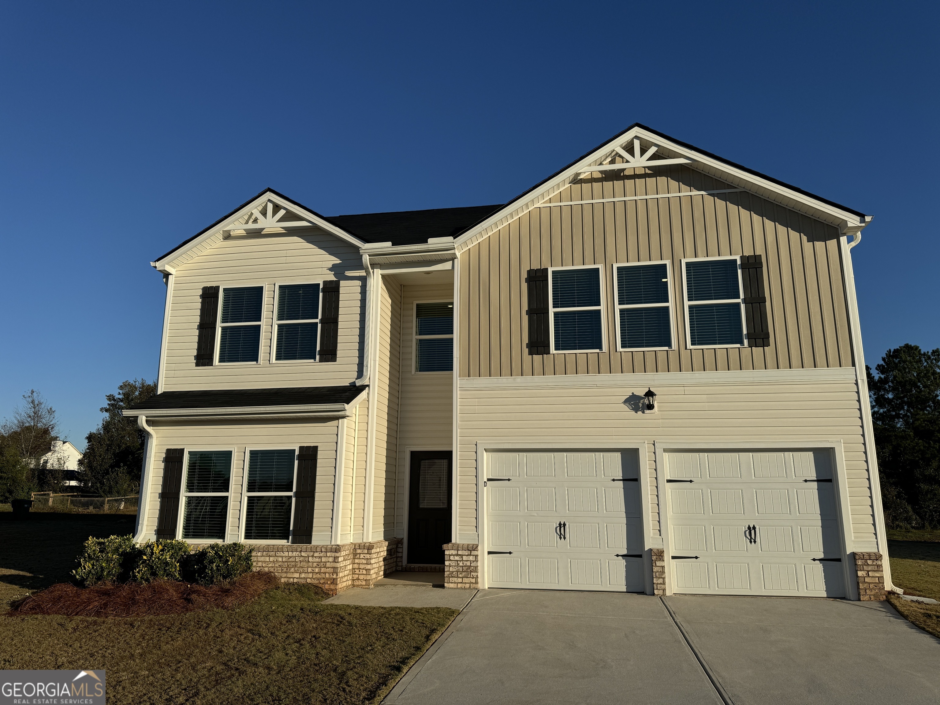 a front view of a house with a yard