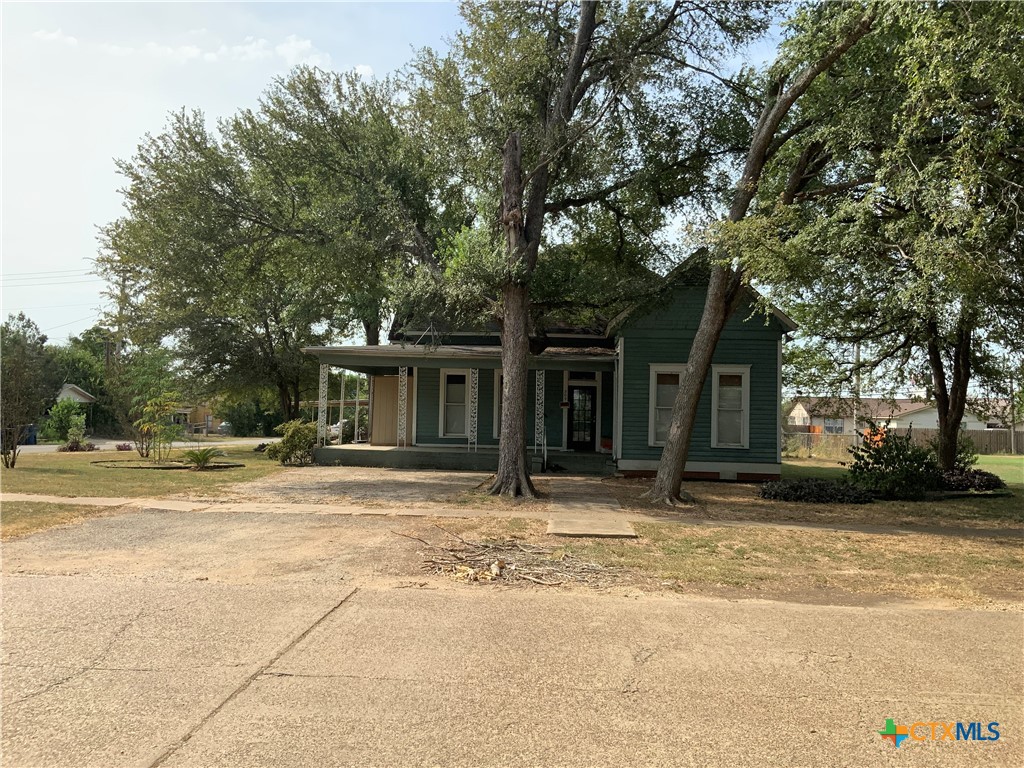 a house with trees in the background