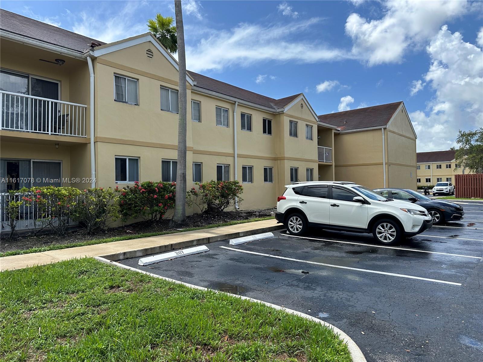 a view of yard with car parked