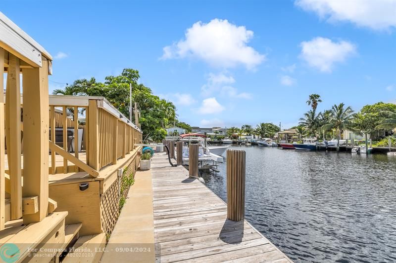 a lake view with a wooden bridge