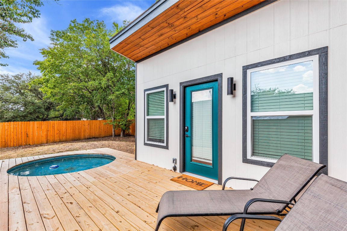 a view of a backyard with chair and table