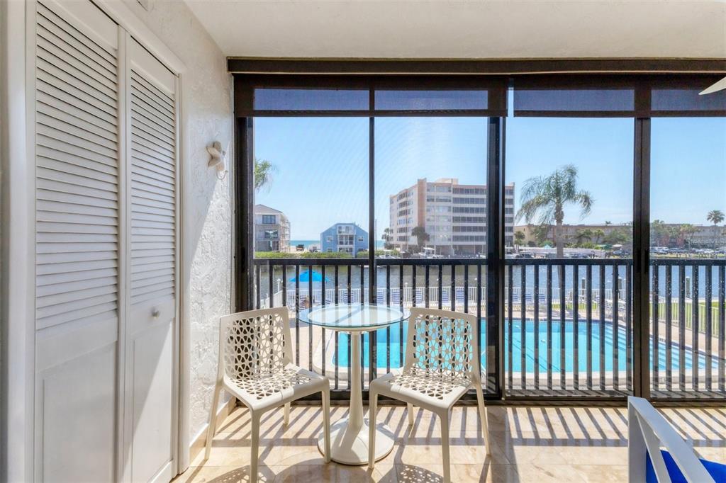 a view of a balcony with wooden floor