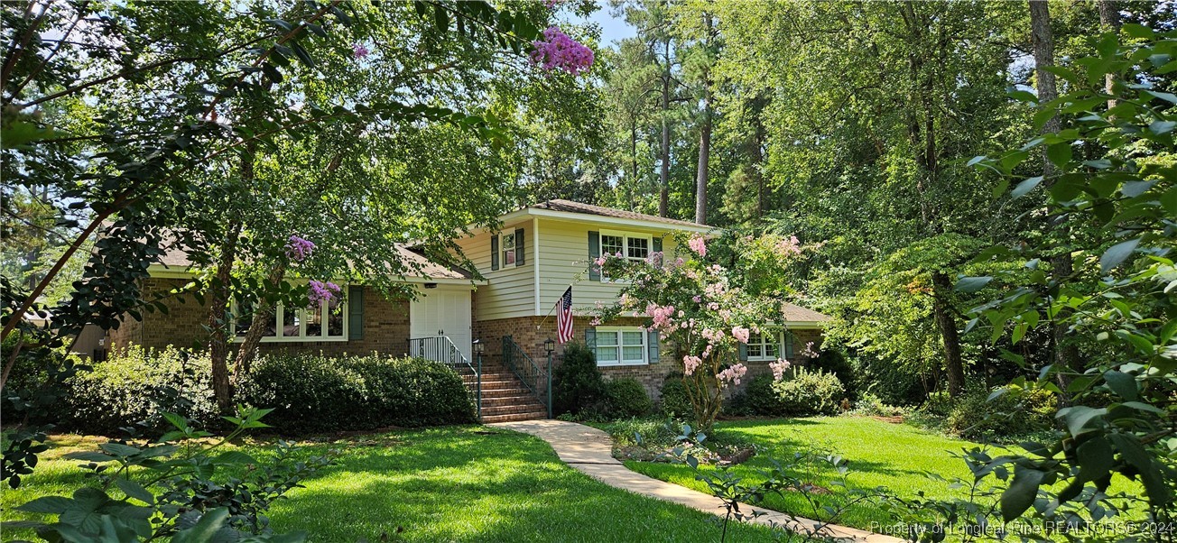 a front view of a house with a yard