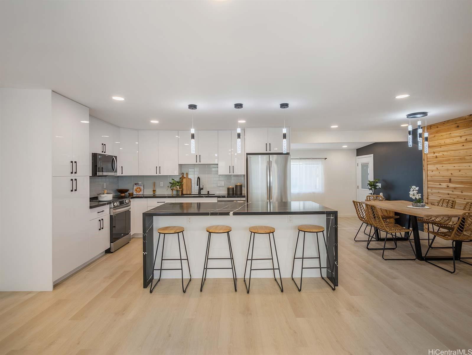 a kitchen with a table and chairs