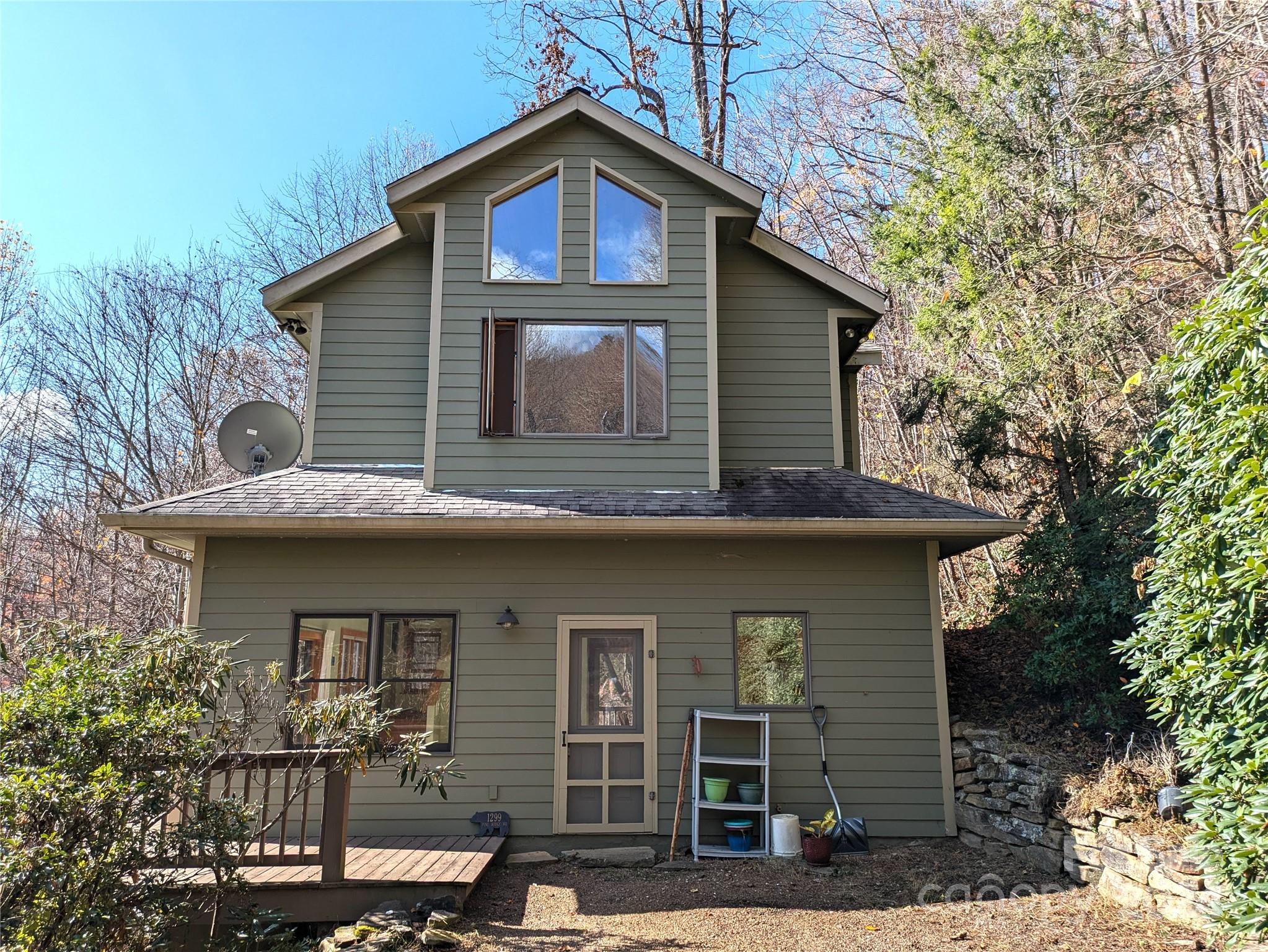 a front view of a house with yard