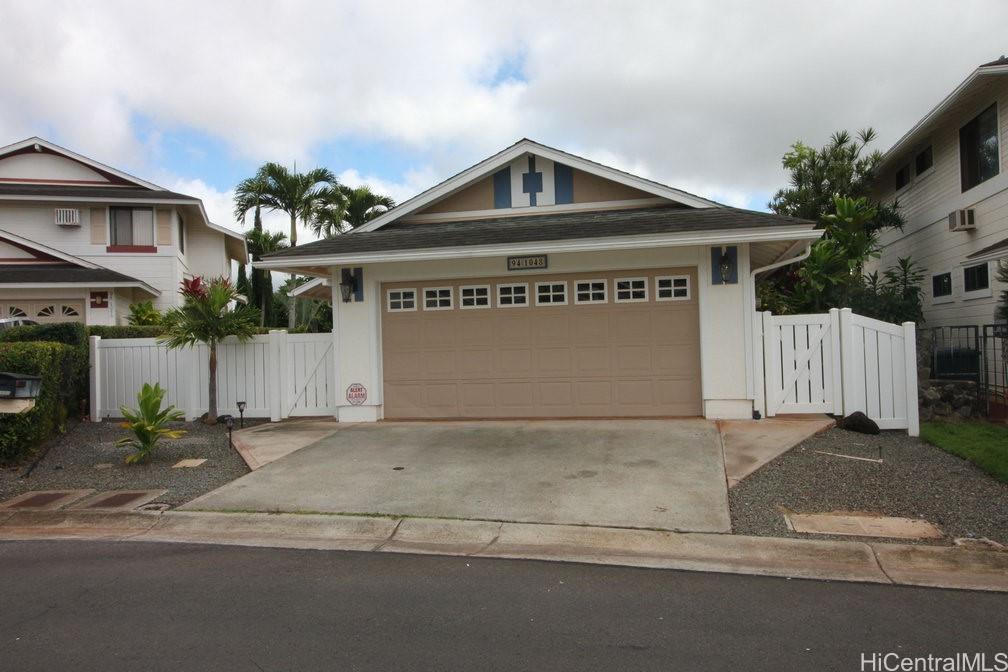 a front view of a house with a garage