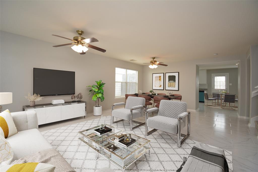 a living room with furniture and a flat screen tv