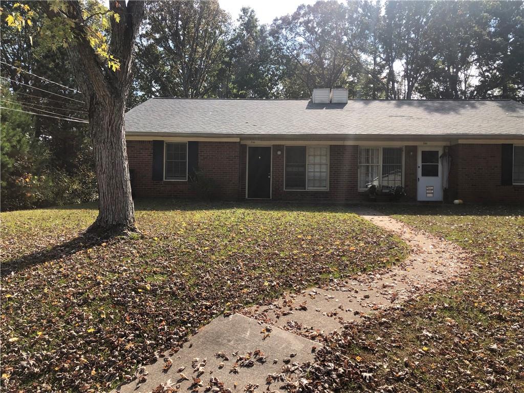 front view of a house with a yard