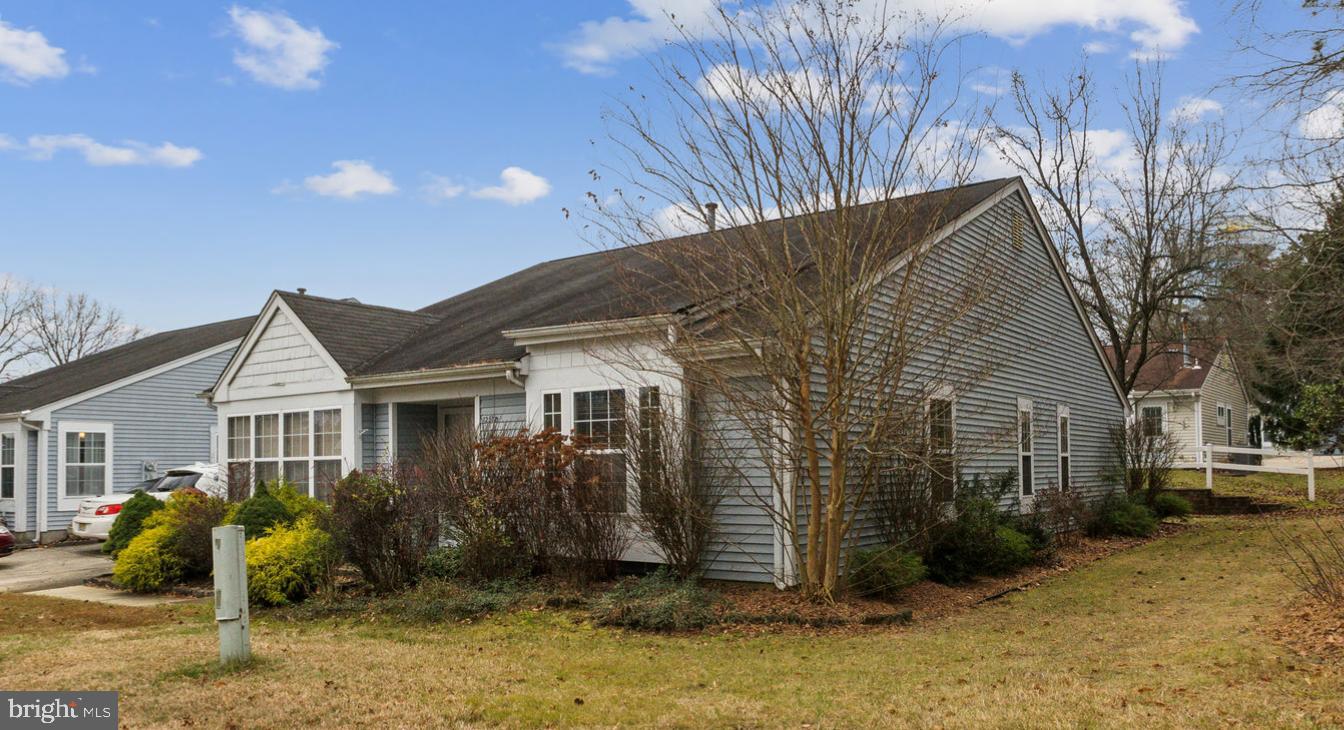 a view of house with yard