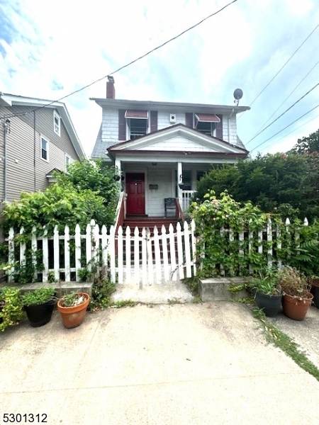 a front view of a house having yard