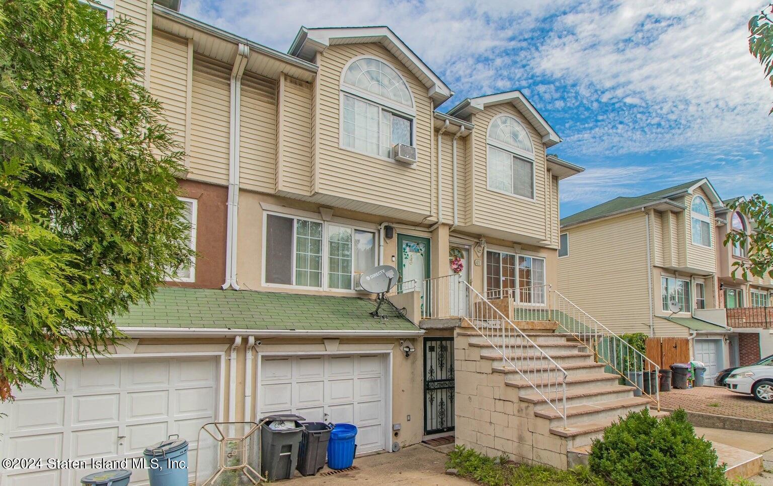 a front view of a house with a garage