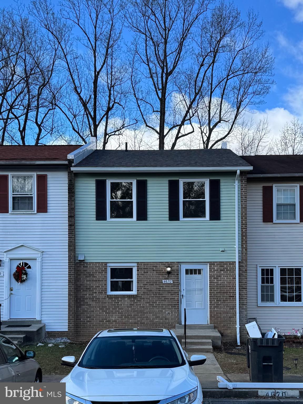 a front view of a house with parking space