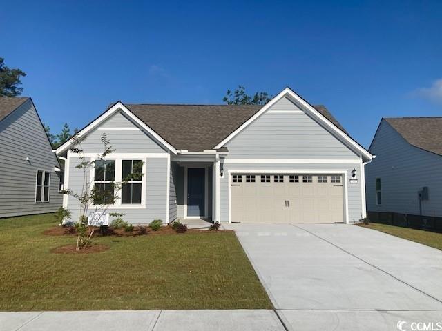 View of front of property with a garage and a fron