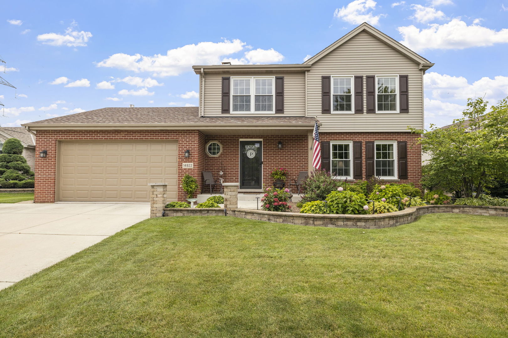 front view of a house with a yard