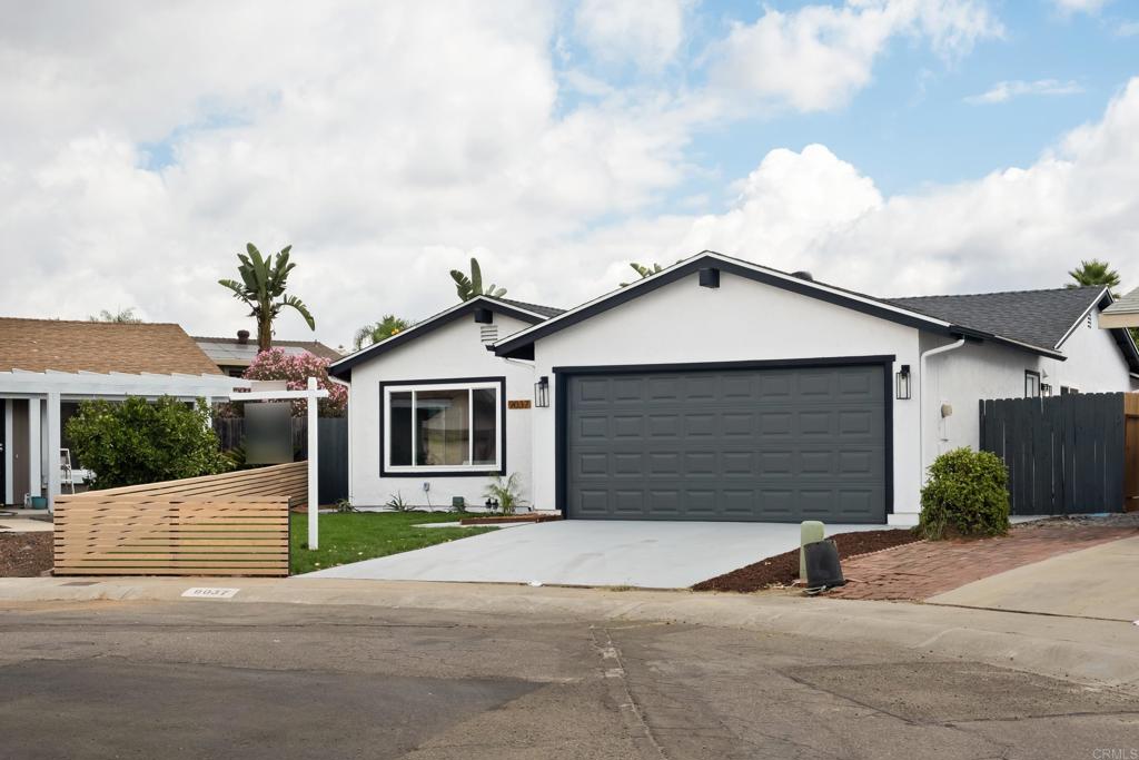 a front view of a house with garage