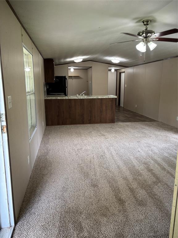 a view of a hallway with a kitchen