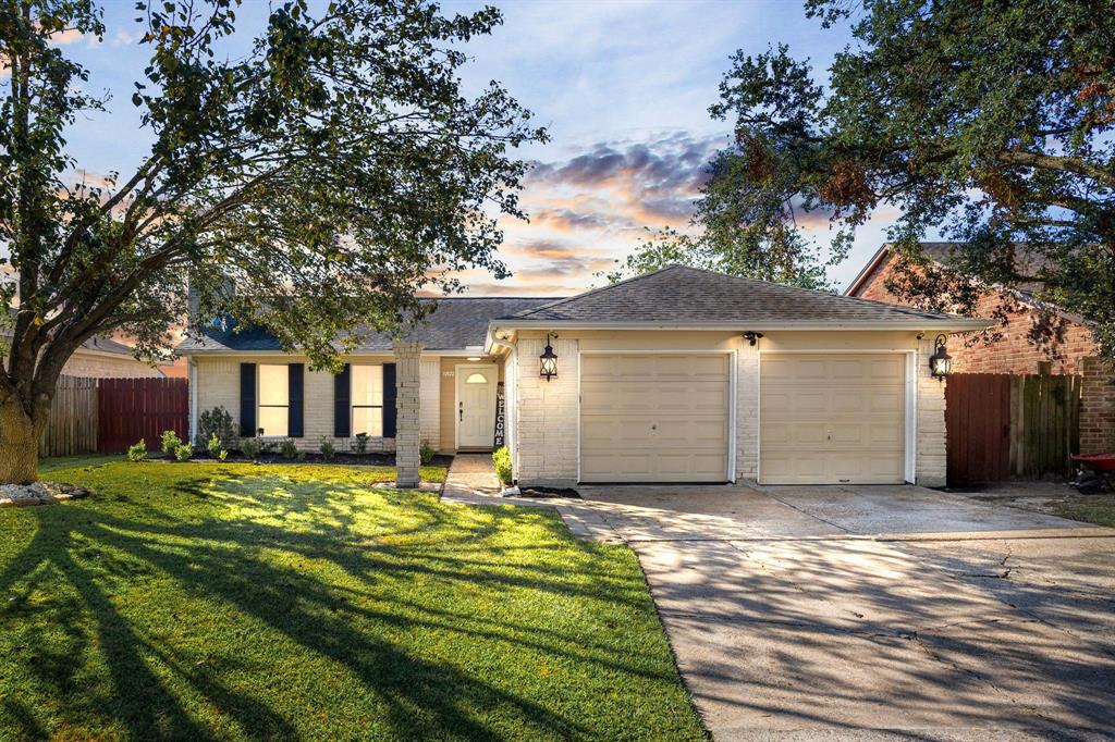 Welcome home to 12522 Drifting Winds located on a quiet wooded street in Parkway Forest and zoned to Shleldon ISD! This stunning home has lovely curb appeal, a well-manicured lawn, beautiful landscaping, brick elevation, front door with glass detailing, covered front porch, traditional style, dark stained shutters, beautiful outdoor lanterns and a double wide driveway!