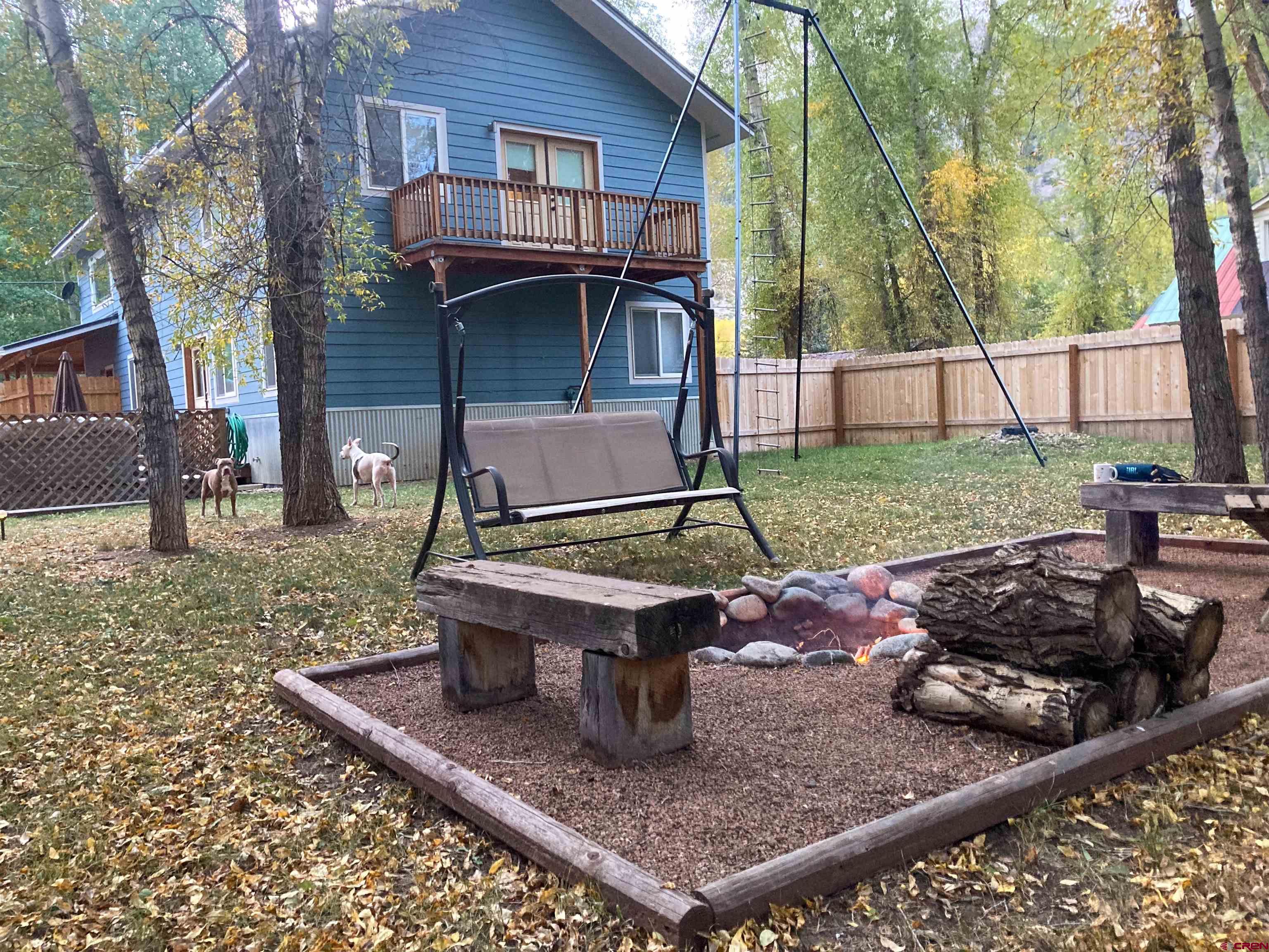 a view of a backyard with sitting area