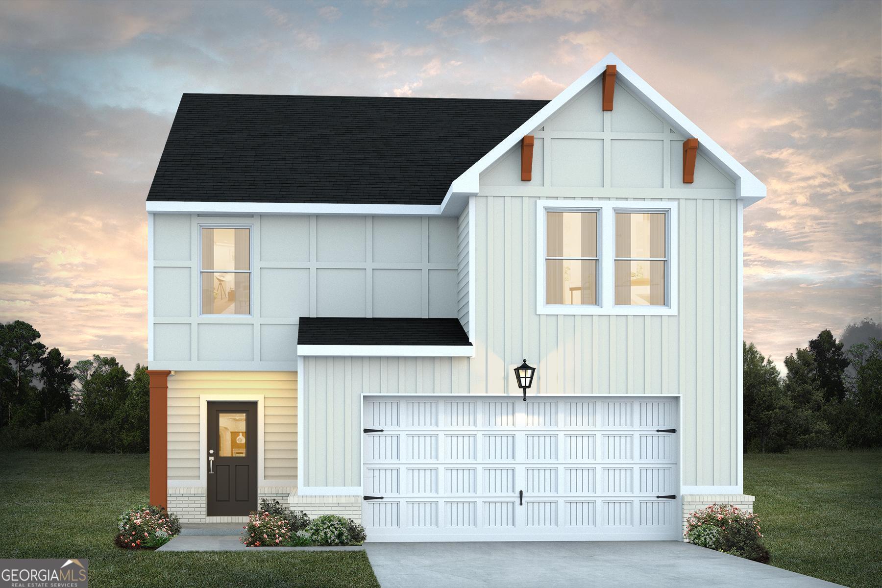 a front view of a house with white fence