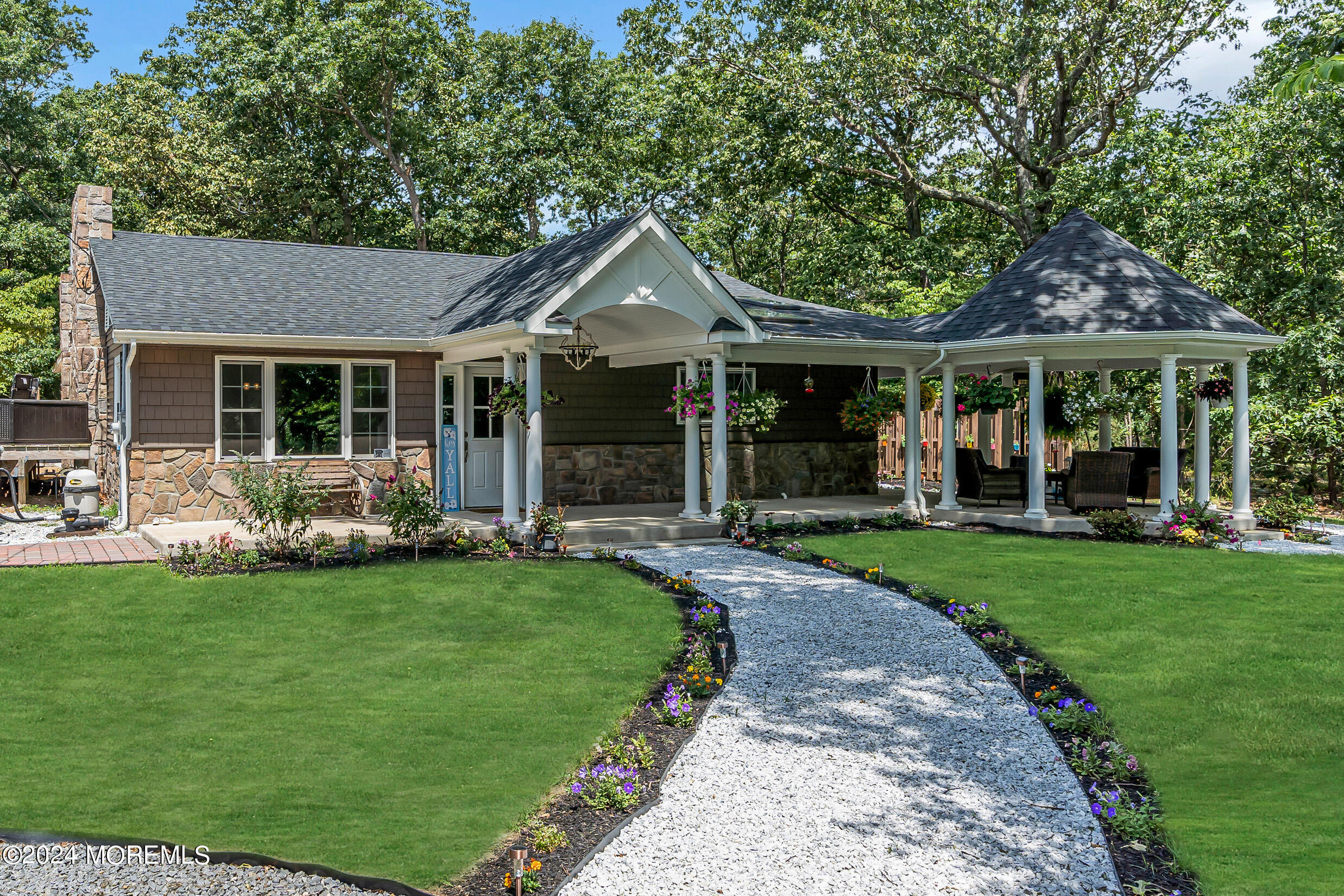 a front view of a house with a yard and porch