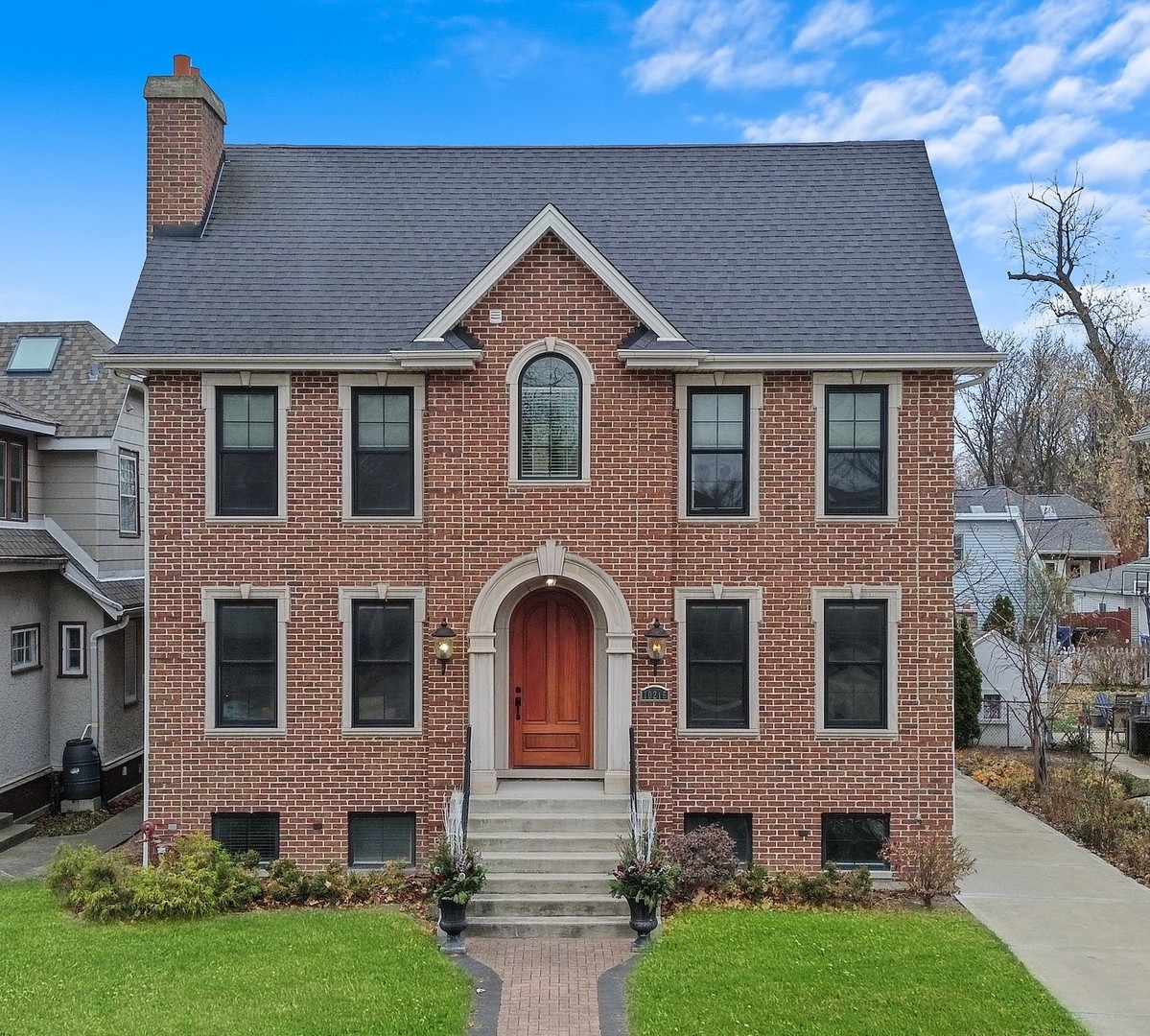 a front view of a house with garden