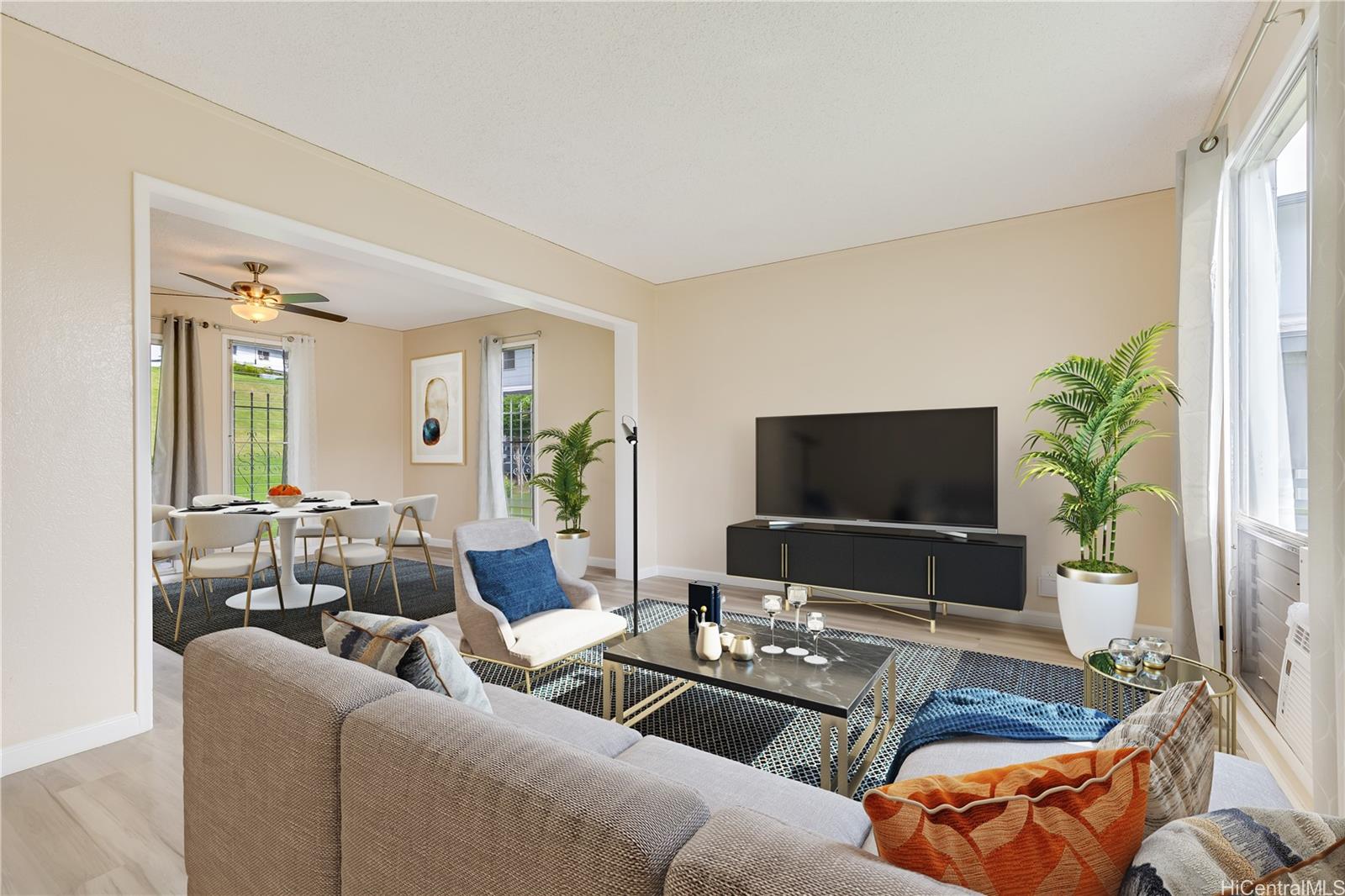 a living room with furniture and a flat screen tv