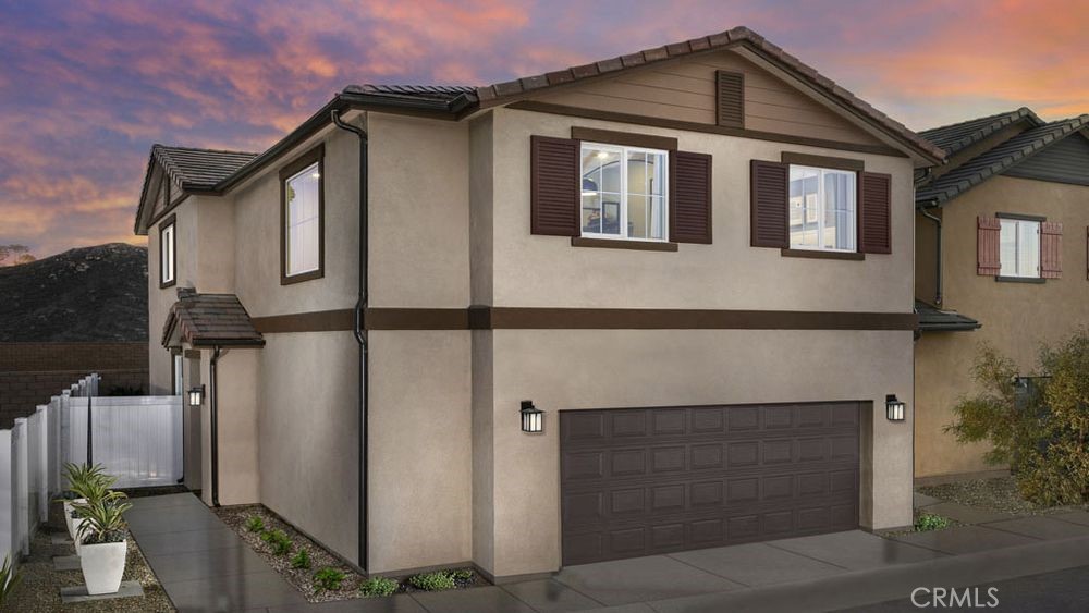 a front view of a house with garage