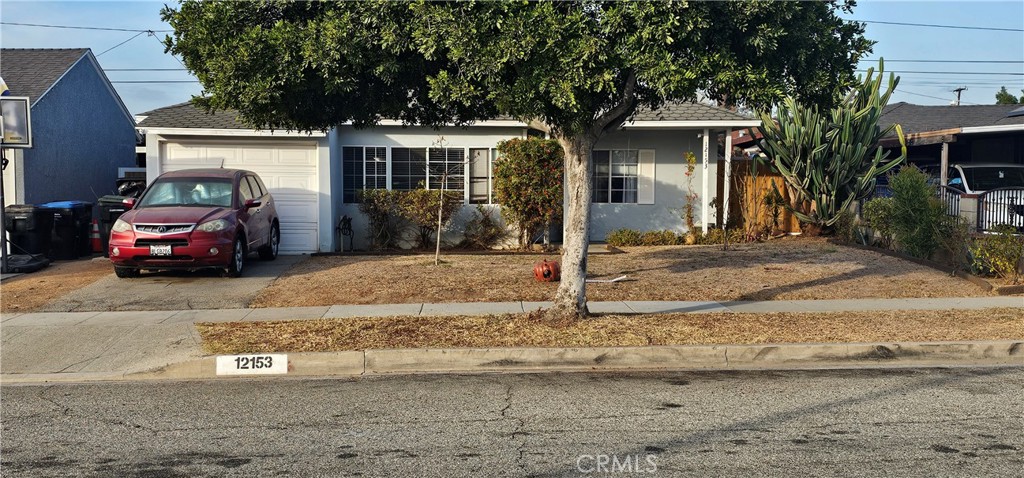 a view of a car parked in front of a house