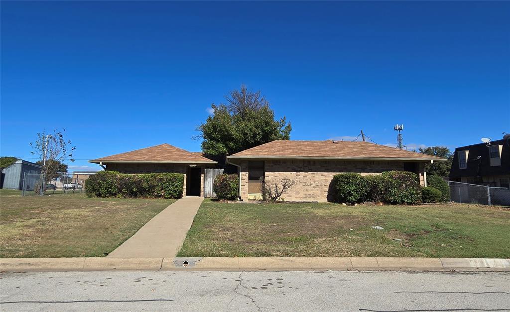 a front view of a house with yard