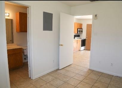 a view of a kitchen from the hallway