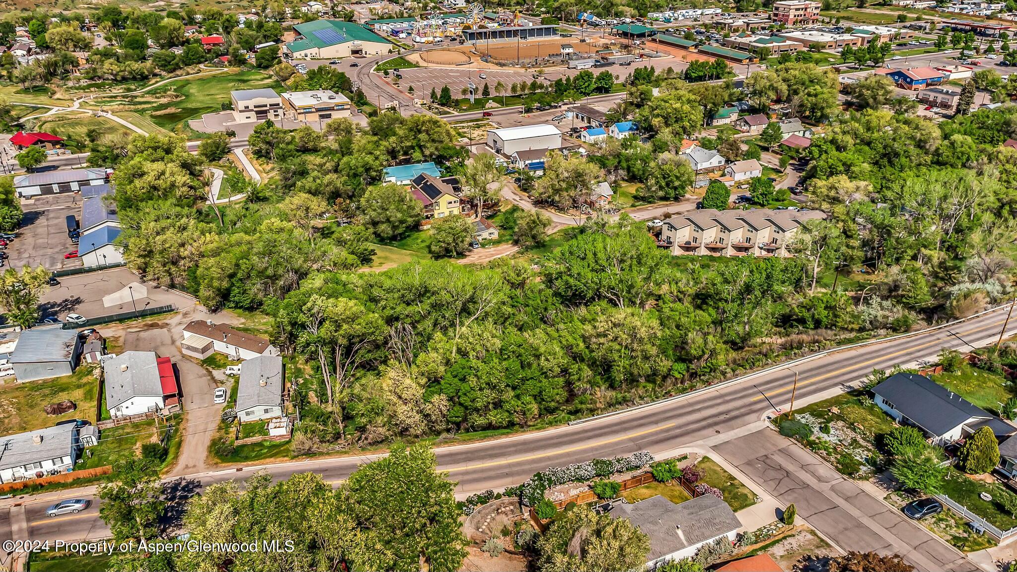 an aerial view of residential house with an outdoor space and seating