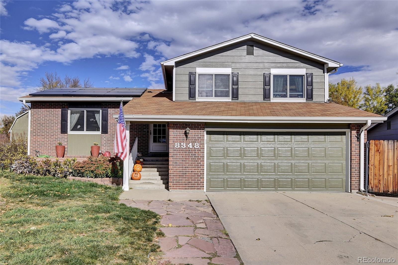 a front view of a house with yard