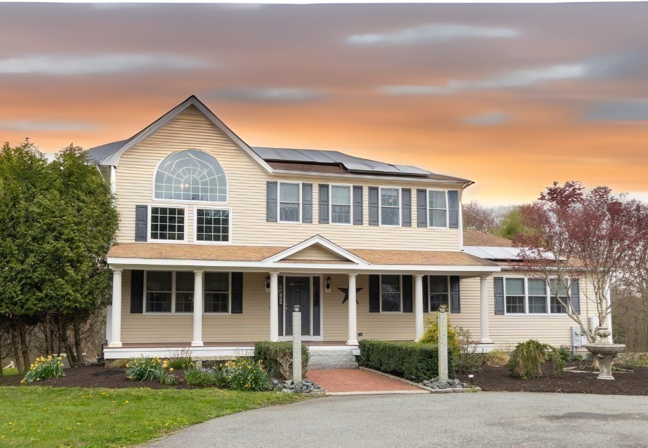 a front view of a house with a yard